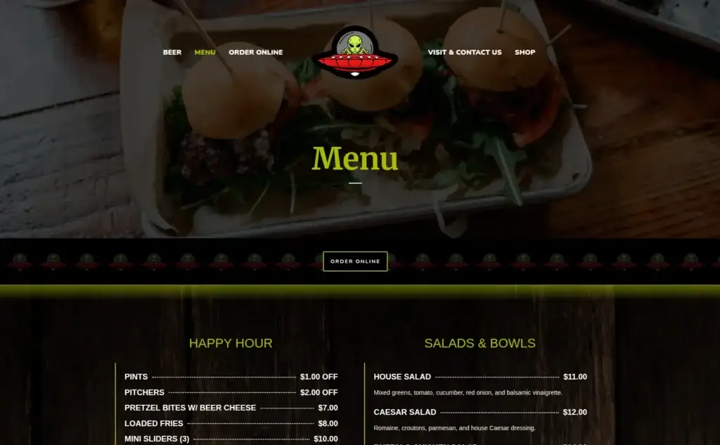 Green Brewery food menu page with a burger-photo header and two-column menu on a wood background.