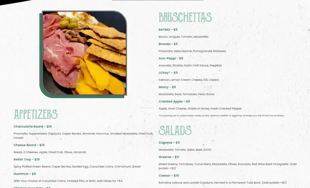 The Greedy Hamster food menu with appetizer, bruschetta and salad sections beside a food photograph.